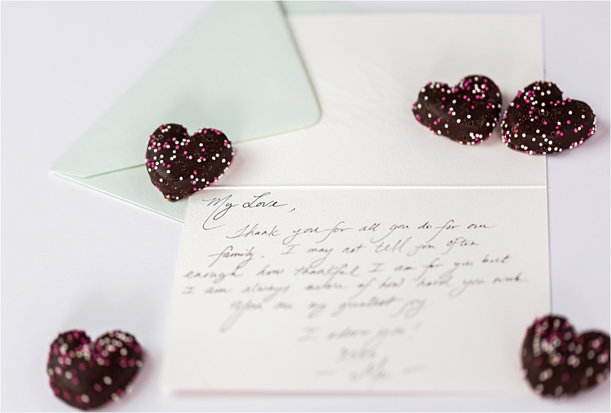 Handwritten love note with Valentine's Day Chocolate hearts.