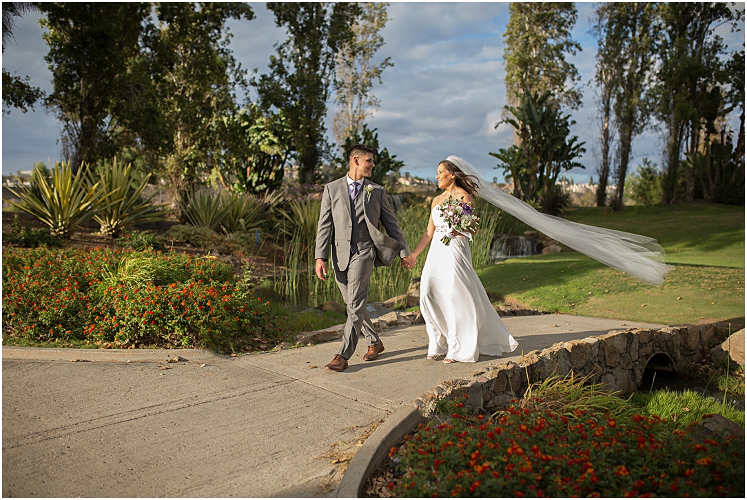 Bride and groom walking at the San Diego Riverwalk Country Club.
